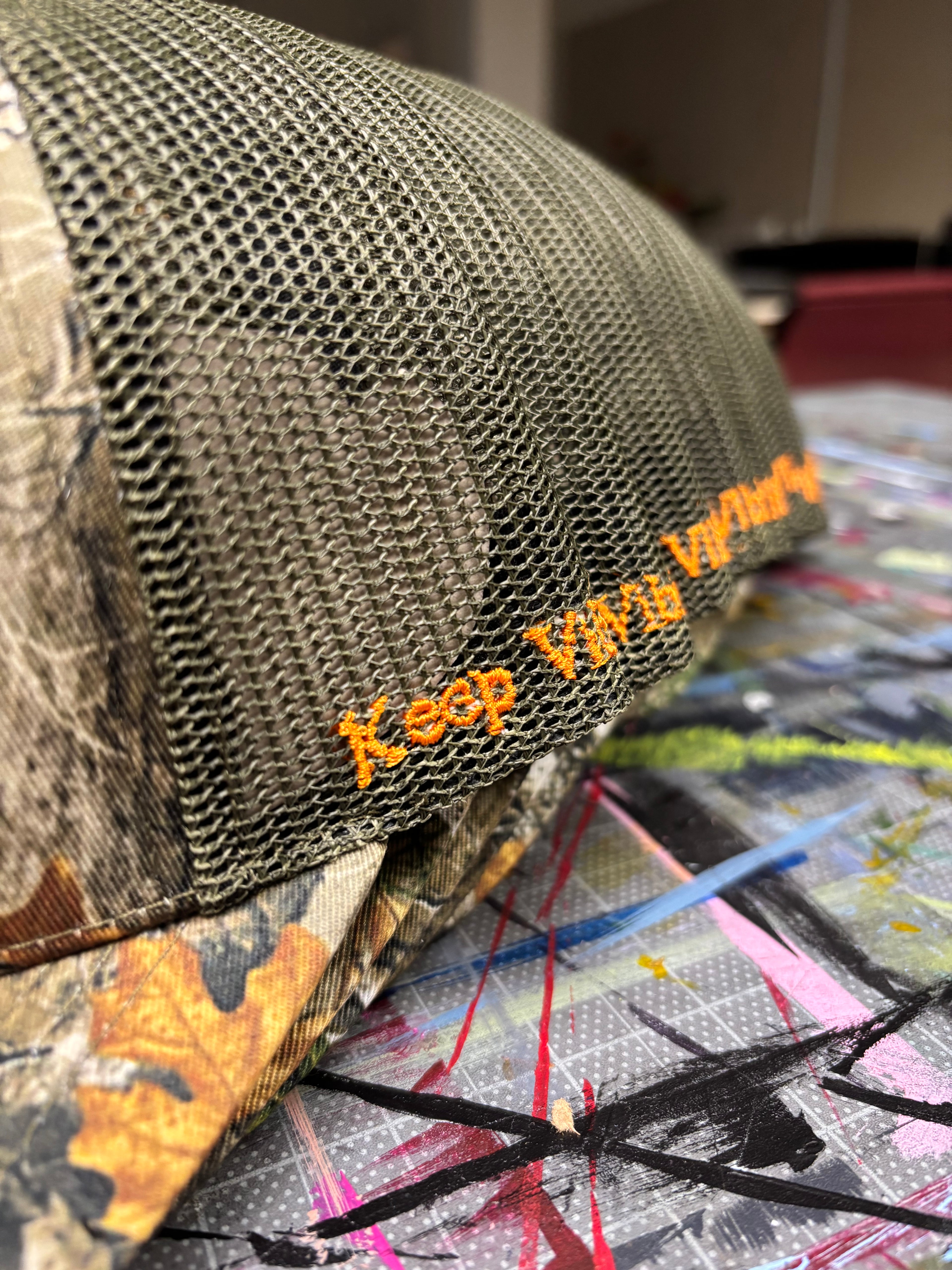 “Standing Out” Camo Trucker Hats