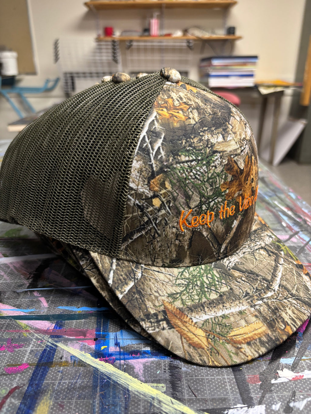 “Standing Out” Camo Trucker Hats