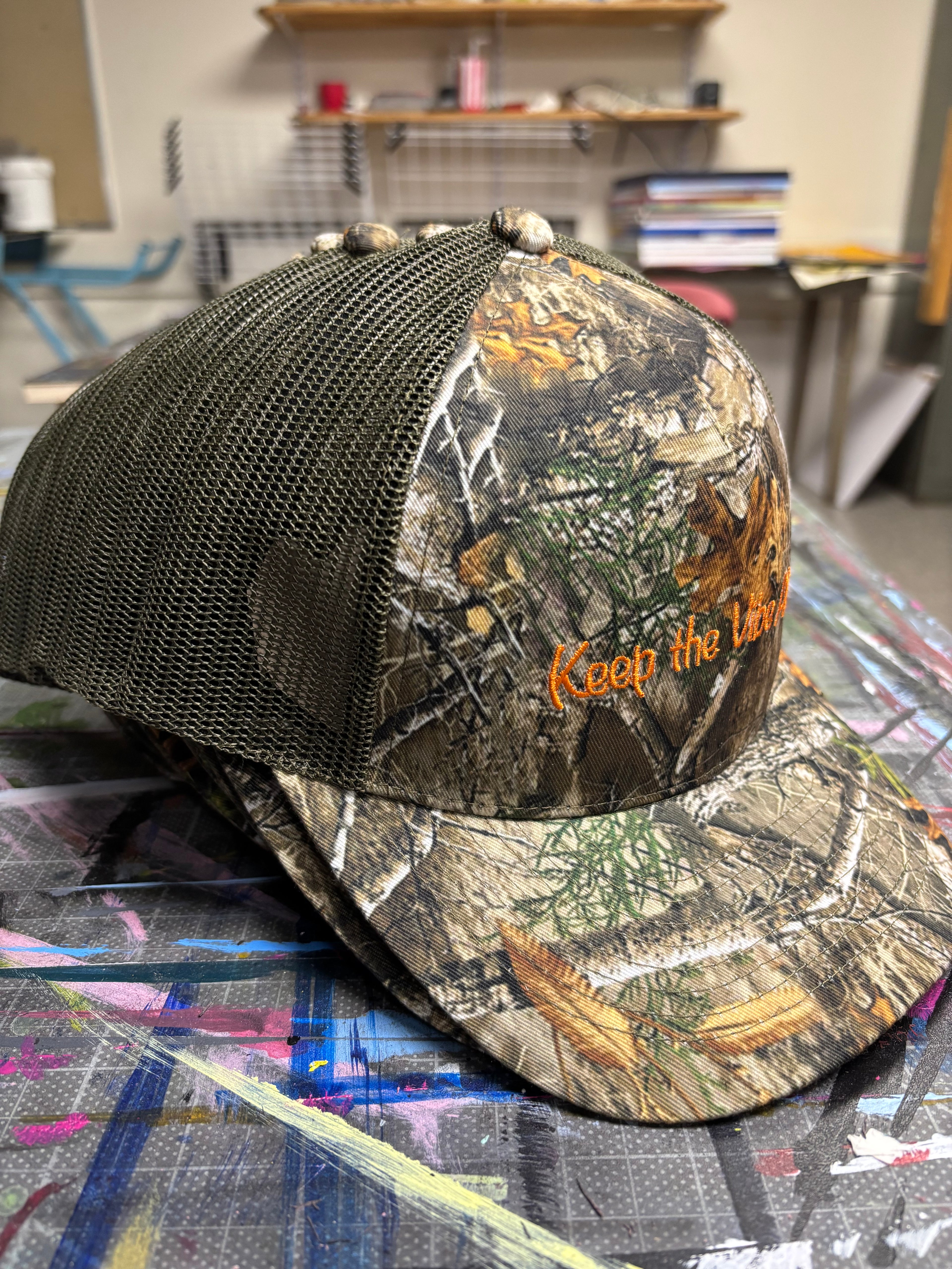 “Standing Out” Camo Trucker Hats